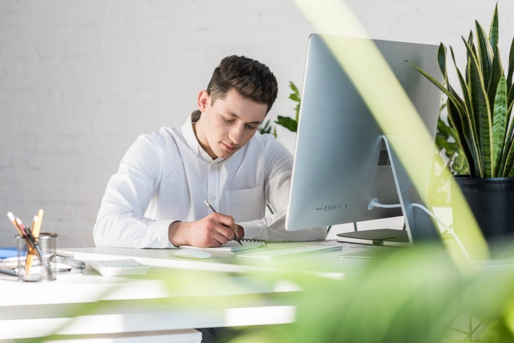 Business person taking notes